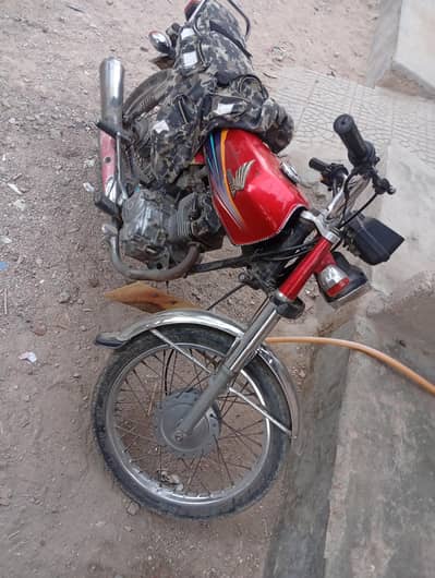 honda CG 125 Faisalabad num hai 2011 model hai 03121154118