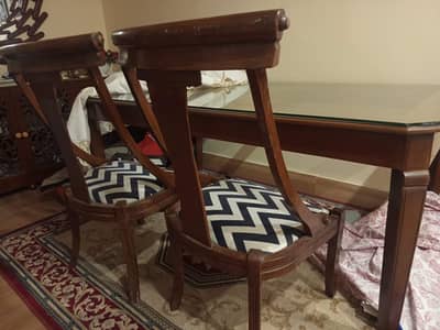 Dining table with glass top and six chairs