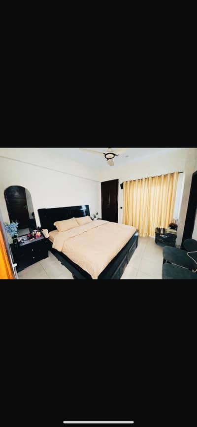 Black wooden bed  and side tables from motli foam