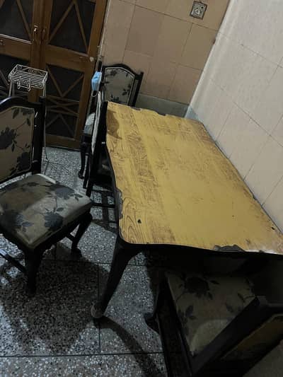 pure wood table and four chair and one iron stand free.