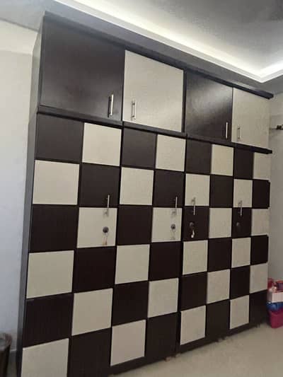 Bed set with 6by6 bed two side tables one dresser and  4 door cupboard