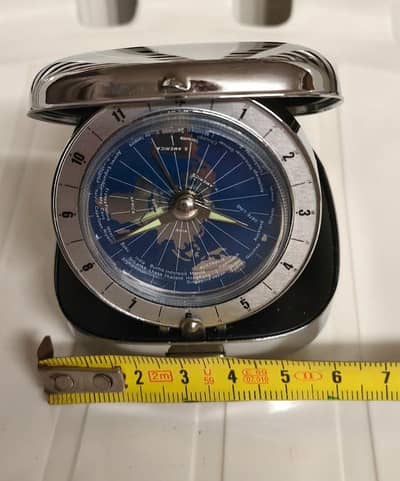 imported world time  unique alarm clock. unique disc clock accident