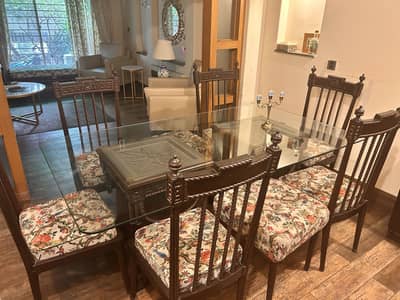 Glass top dining table for 6 chairs and two stools
