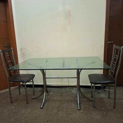 Glass top dinning table alongwith chairs