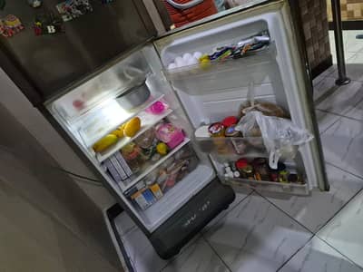 Sharp double-door refrigerator for sale in good working condition.