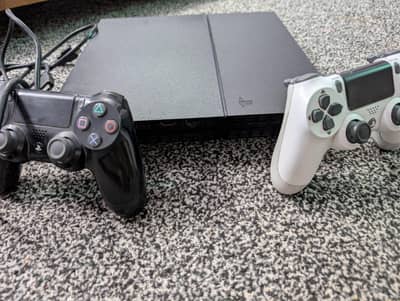 PS4 with 2 Controllers + 3 FIFA Games