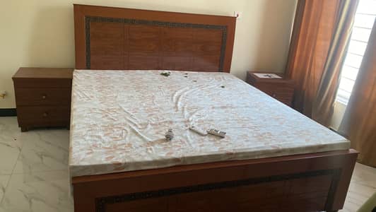 Bed with side tables