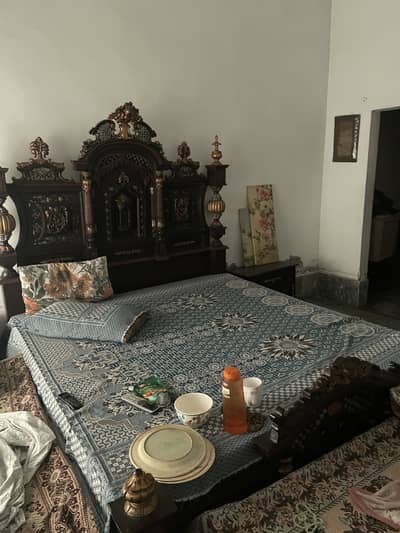 Wooden bed with 2 side table and show case