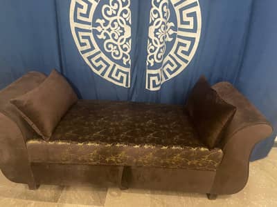 2 seater comfortable brown Sofa (Cushions included).