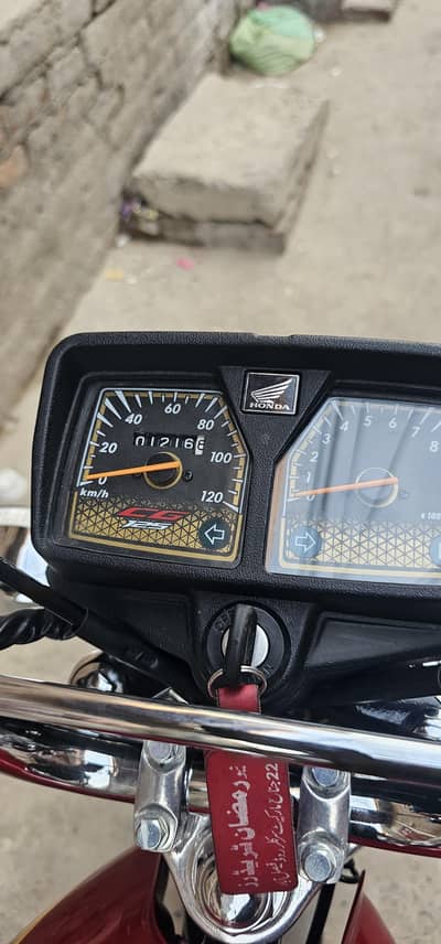 Honda 125 self start golden edition red color number lga lush condi