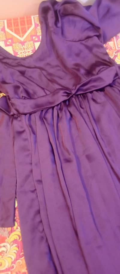 This is a very beautiful dress. It has a tail.