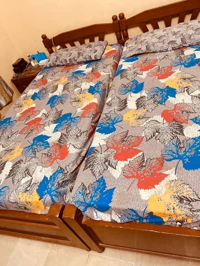 2 Single Beds with 2 side tables without mattress.