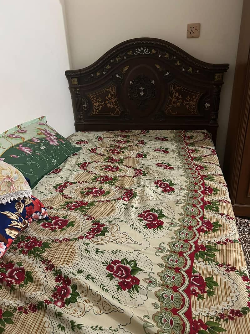 single Woden bed one side table 0