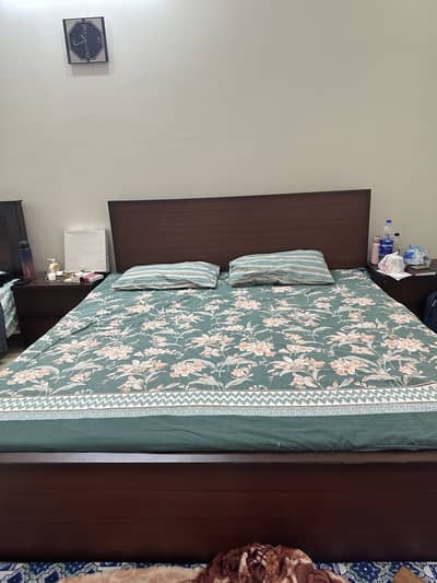 Bed with side table and sofa
