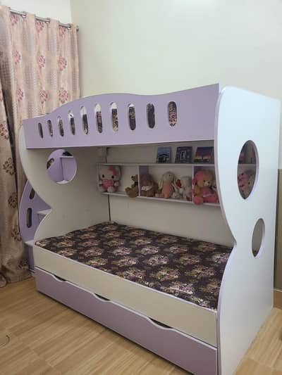 Bunk Bed with 3 mattresses and cabinets to store stuff