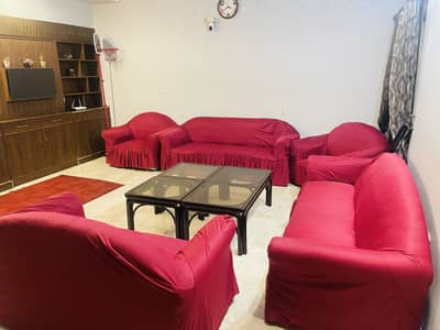 Used sofa set  ( with maroon and black sofa covers)