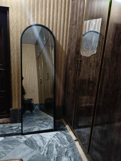 Mirror made with metal frame