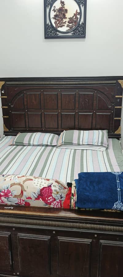 king bed with dressing and side tables