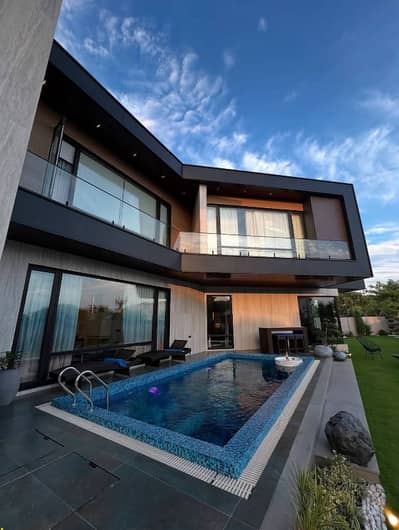 SYED BROTHERS PROUDLY OFFERS: 1-Kanal Elegant Bungalow with Cinema & Pool Is Available In The Best Block Of DHA Lahore.