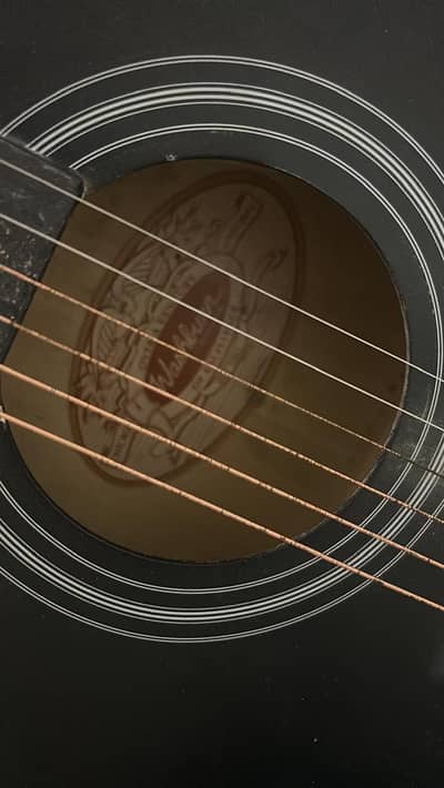 washburn black acoustic guitar