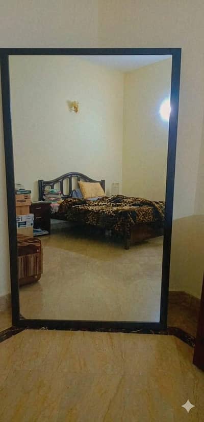 Bed with tables and long mirror