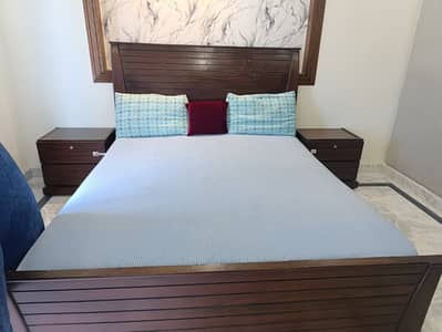 Queen size wooden bed with molty spring mattress