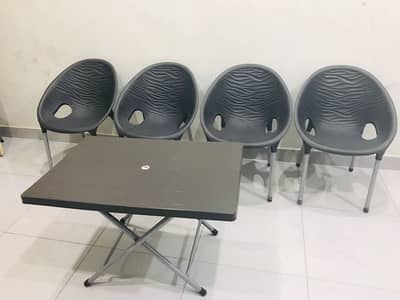 Plastic chairs with table