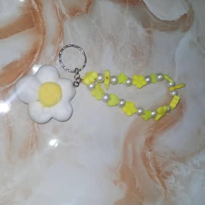 flower made from clay and charm made from bets