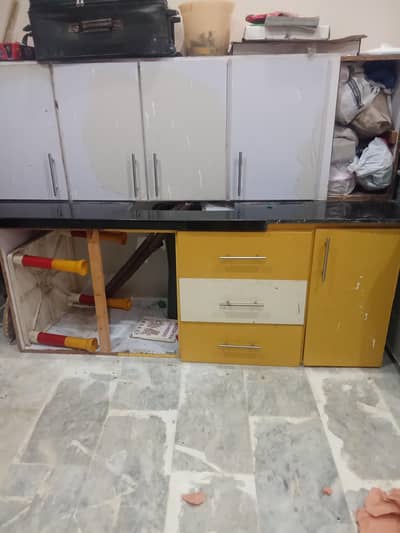 kitchen sink, couter and black marble top