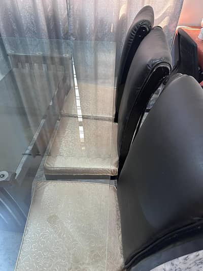 Dinning Table with 8 chairs, Glass top, In very good condition.