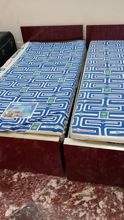 two single beds with mattress