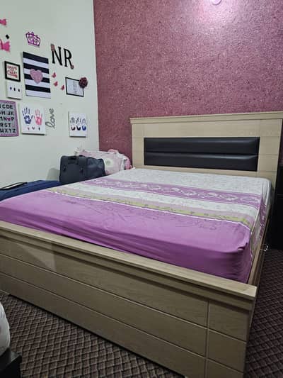 Queen size bed with big base cabins on both sides