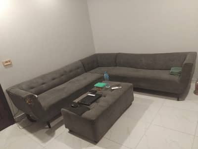 l shape sofa for sale with grey centre table.