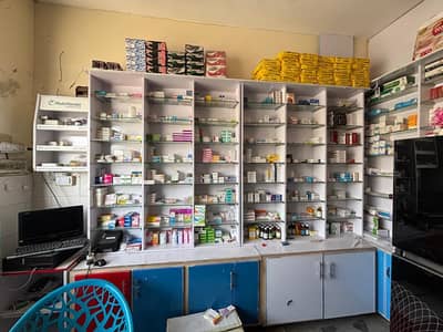 Running pharmacy For sale corner shop Near Aziz Fatima hospital Fsd