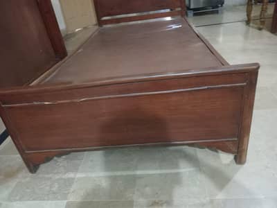 2 Single beds made of wood