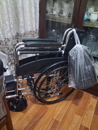 Wheelchair with breaks and commode