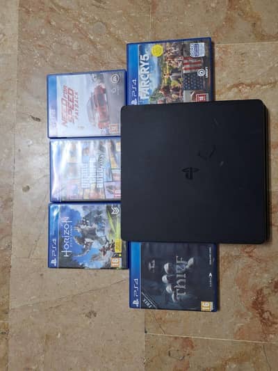 PS4 slim with gaming CDs