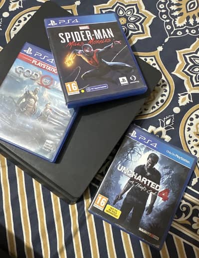Playstation 4 with 2 controllers and games