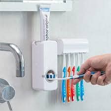 Toothpaste Dispenser with Toothbrush Holder Set available for sale.