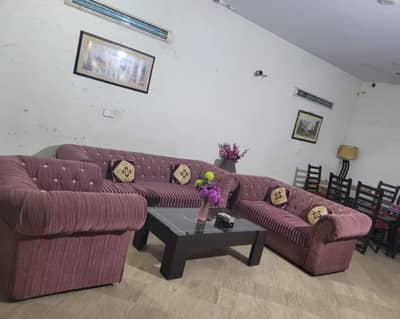 6 seater sofa with wooden centre Table in good condition