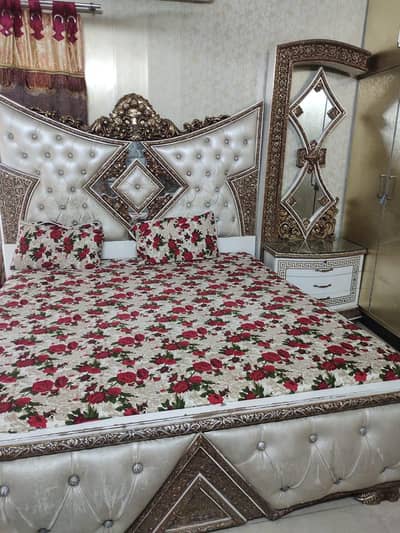one bed two side tables and dressing
