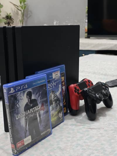 PS4 Pro with 2 controllers and 3 AAA games