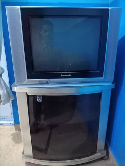 Panasonic TV along with trolley.