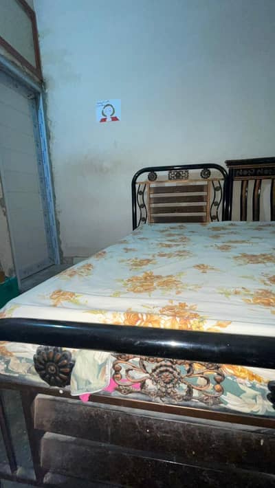 single iron bed with mattress