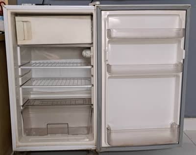 Room fridge in good working condition.