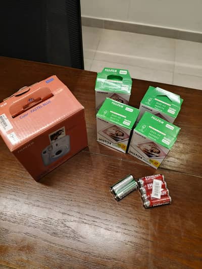 Fujifilm Instax Mini 12 Camera Bundle – Includes Film & Batteries
