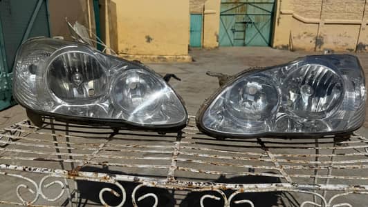 2007 model Corolla head lights, side auto mirrors, plastic panels