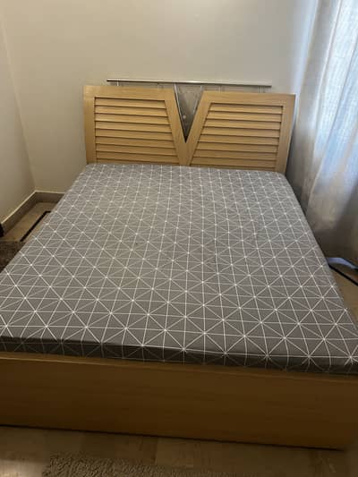 Light beige colour wood bed