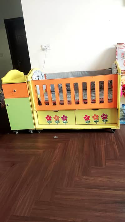 Baby cot along with diaper changing table