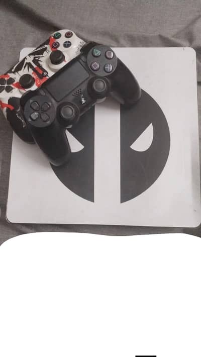 PS4 Slim with 2 Controllers – Excellent Condition